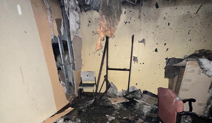 Room severely damaged by fire and smoke