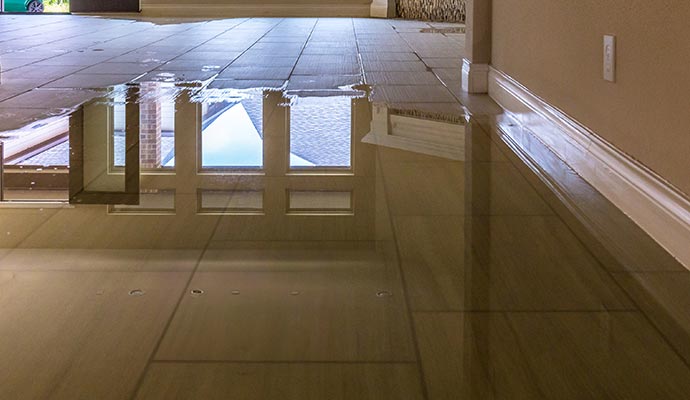 Tile floor flooded in a room